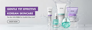 A promotional banner for Anua Korean skincare products, featuring several white and purple bottles and jars alongside a teal spray bottle, set against a white background with water splash graphics and text reading 'GENTLE YET EFFECTIVE KOREAN SKINCARE'.