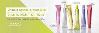 Promotional banner for Arencia Booster showing several cosmetic tubes in pink, yellow, white, green, purple, and red on a split green and white background with text reading 'WHICH ARENCIA BOOSTER SHOT IS RIGHT FOR YOU?' and 'SHOP NOW'.