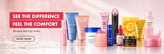 A promotional banner featuring multiple skincare products from the brand Medicube, arranged on a glossy white surface against a soft pink background. The products include various tubes, jars, and bottles in shades of blue, pink, yellow, and white.

